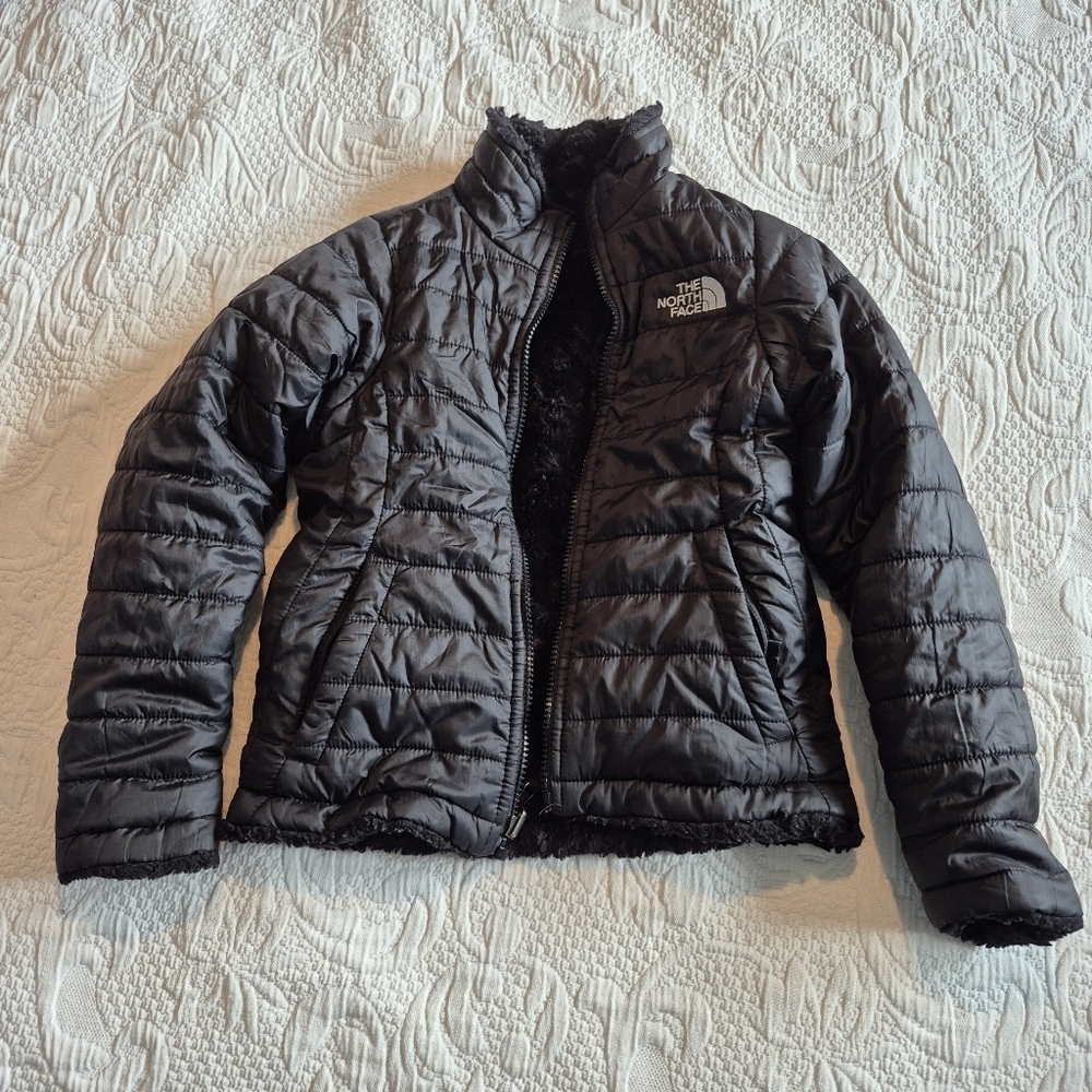 North Face girls size XS or 6 reversible jacket has a couple small cuts pictured